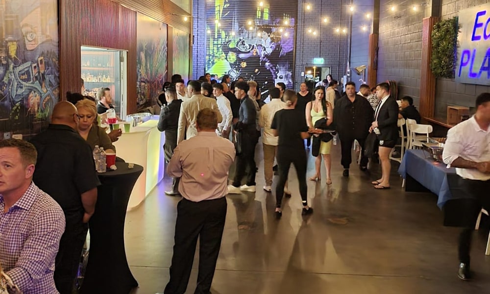 Elegant Bar & Lounge Setup at Ed’s Place – Party Venue Near Keysborough Guests enjoying drinks near a glowing LED bar at Ed’s Place, an event space near Keysborough and Narre Warren